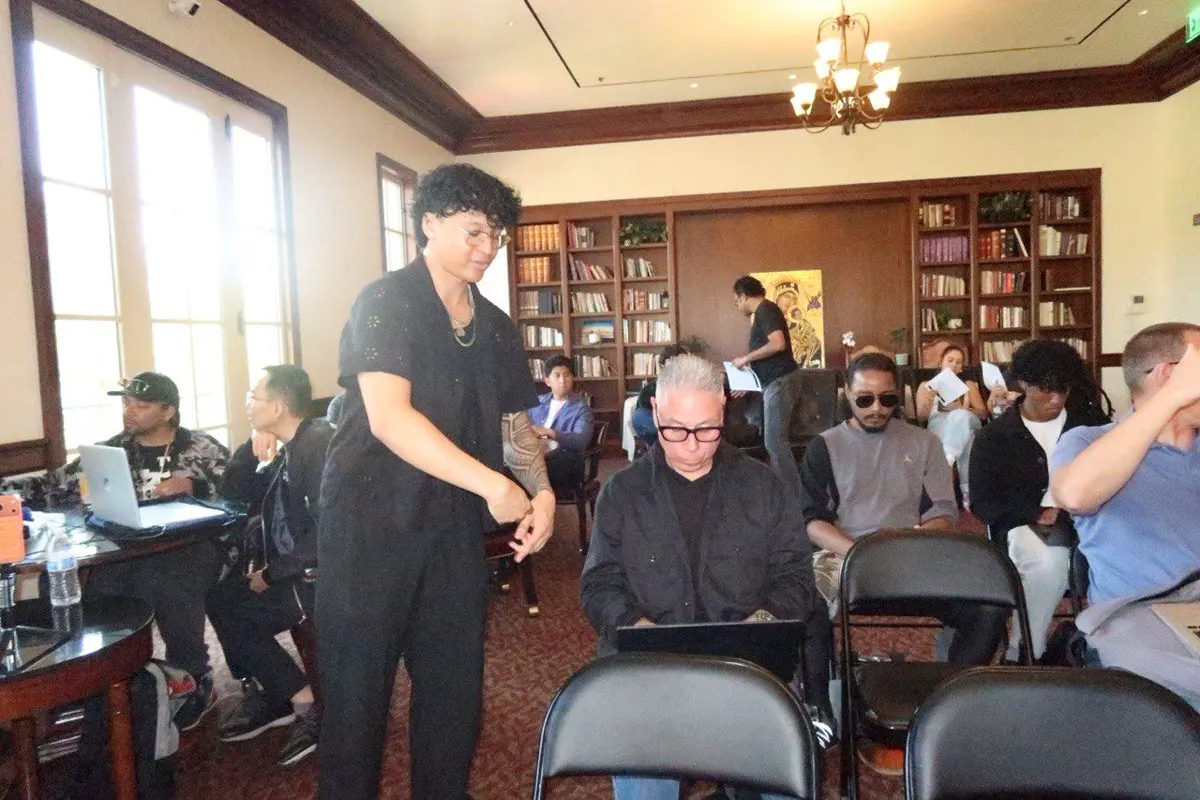 Bootoshi helping a student during the USC Agentic Workshop